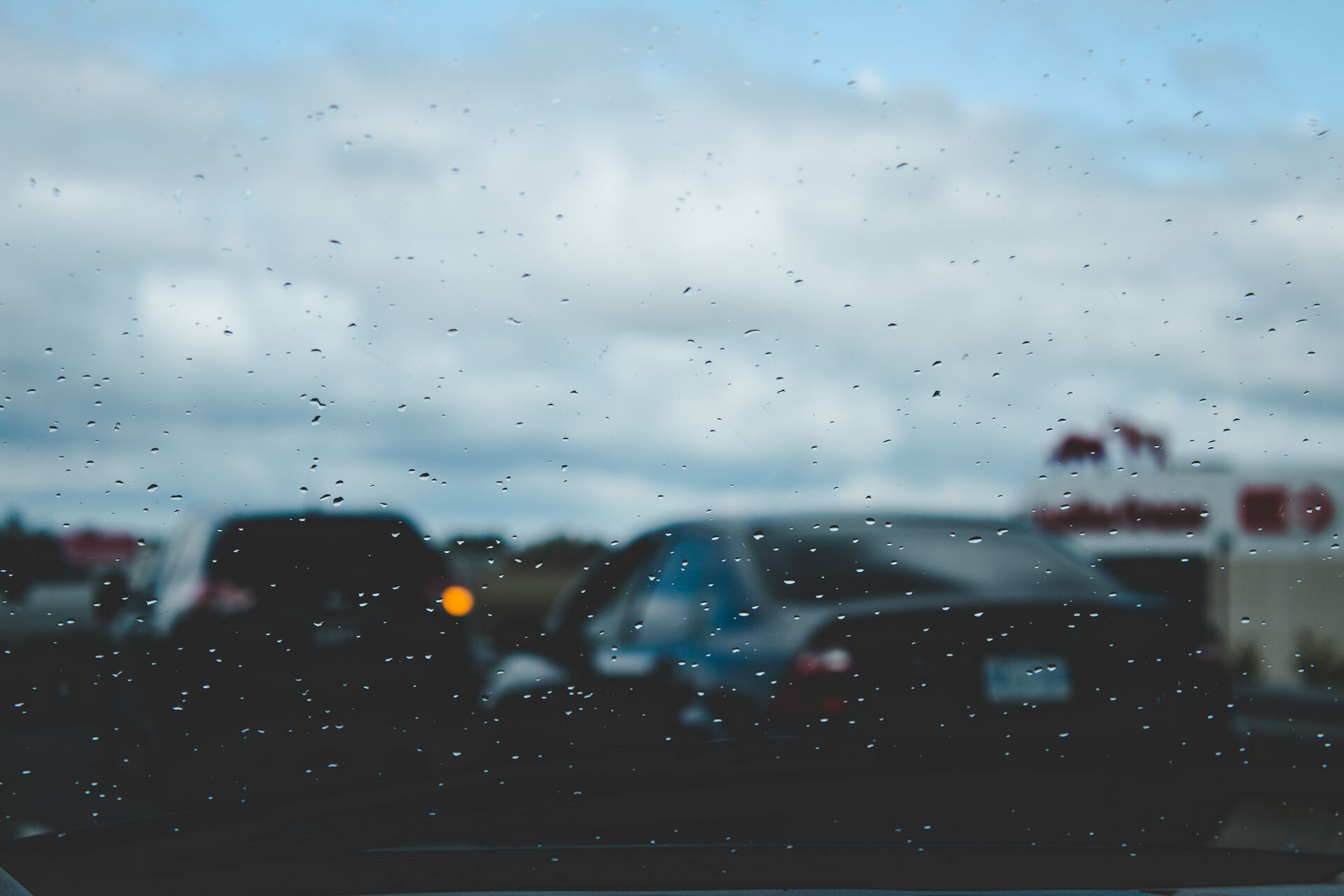 Rain on a windscreen with traffic beyond